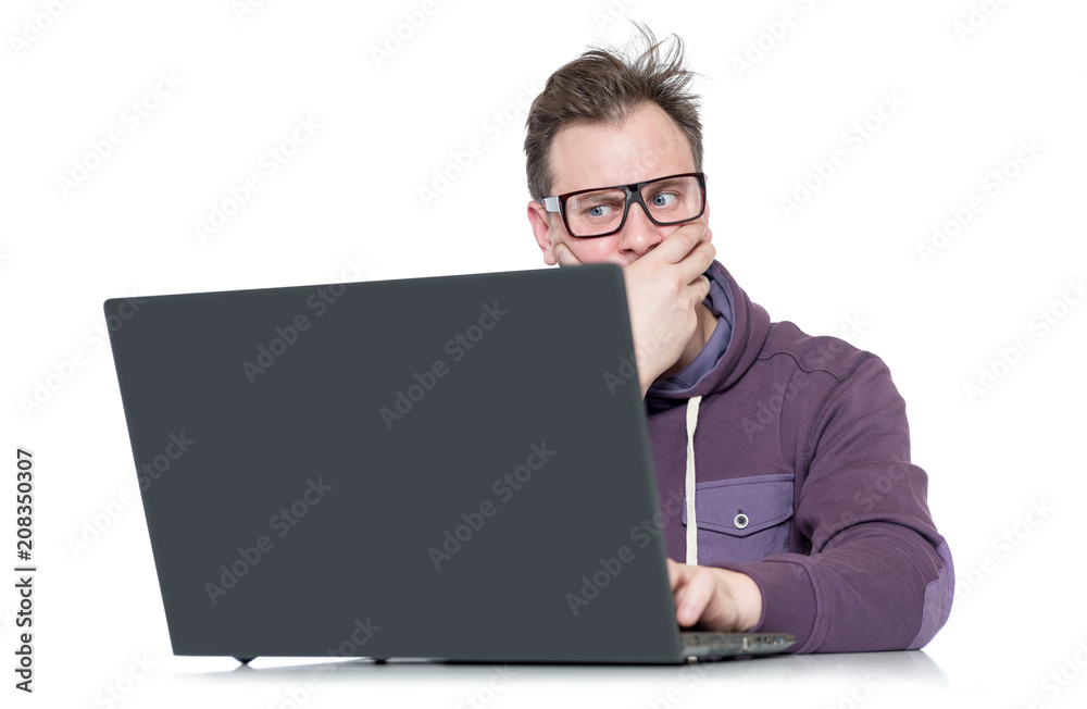 Male programmer in glasses with laptop, isolated on white background Male programmer in glasses with laptop, isolated on white background