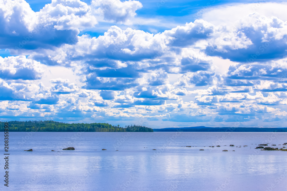 Summer lake view withcumulus clouds. Photo from Sotkamo Finland.