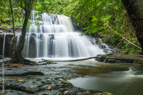 waterfalls in deep forest at  National Park  ,A beautiful stream water famous rain forest waterfall in Thailand
