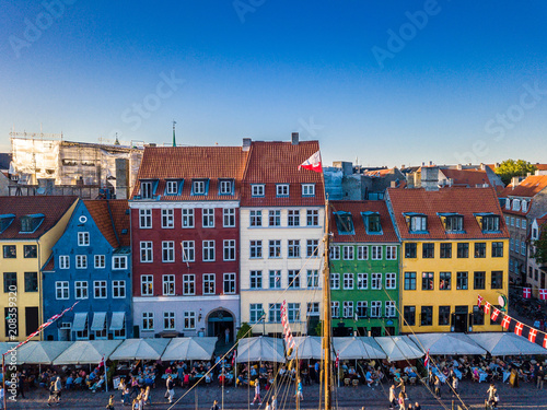 Photography Cozy famouse colorful houses Nyhavn New Harbour canal and entertainment district in Copenhagen, Denmark