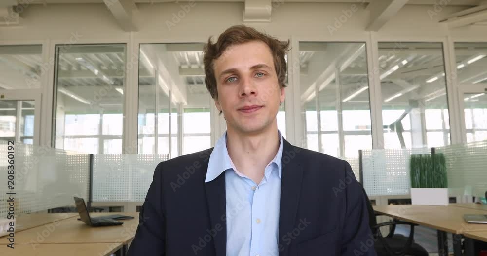 Man business suit shows excellent gesture two fingers Man business suit shows excellent gesture two fingers