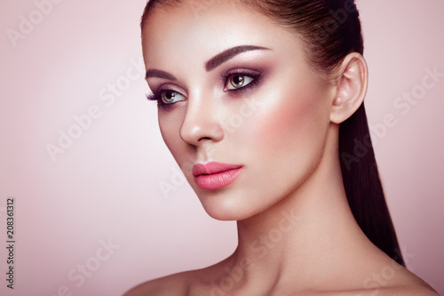 Beautiful Young Woman with Clean Fresh Skin. Perfect Makeup. Beauty Fashion. Eyelashes. Cosmetic Eyeshadow. Highlighting. Cosmetology, Beauty and Spa