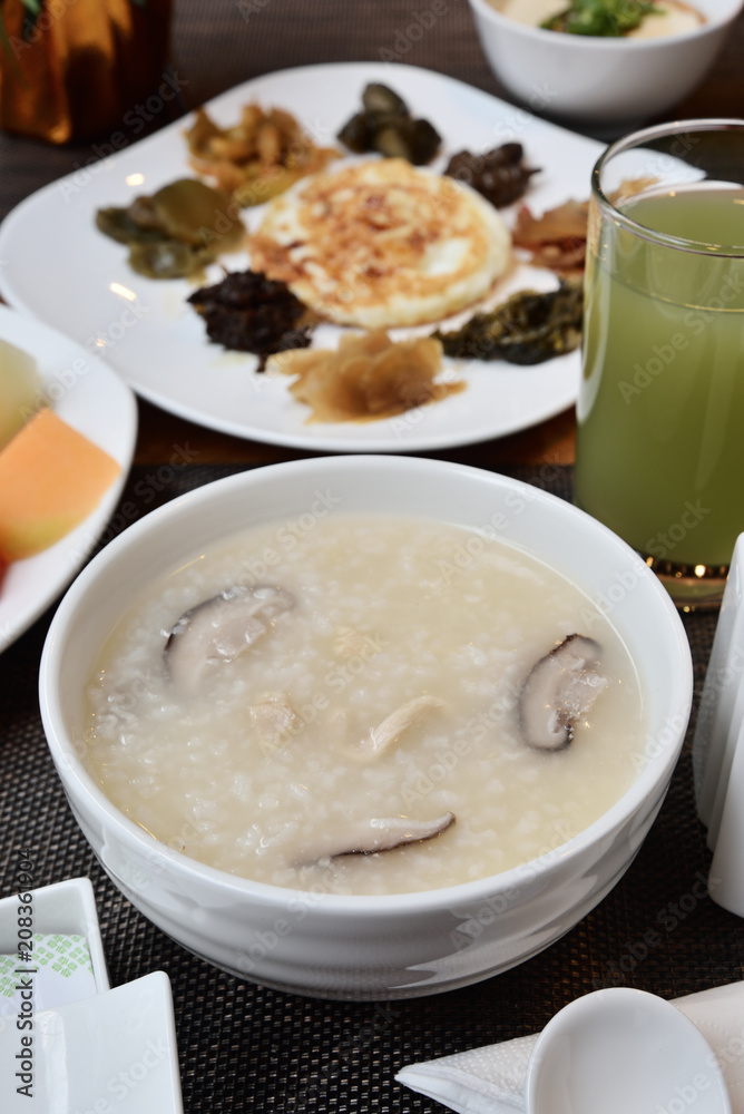 Mushroom meat porridge served with side dish. Mushroom meat porridge served with side dish.