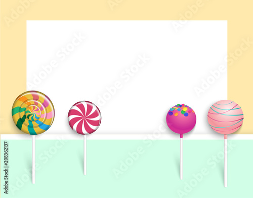 Yellow paper background with color lollipops.
