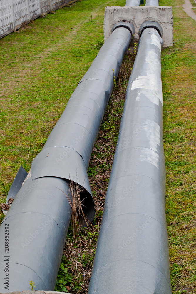 Old metal industrial pipes located on the ground Old metal industrial pipes located on the ground