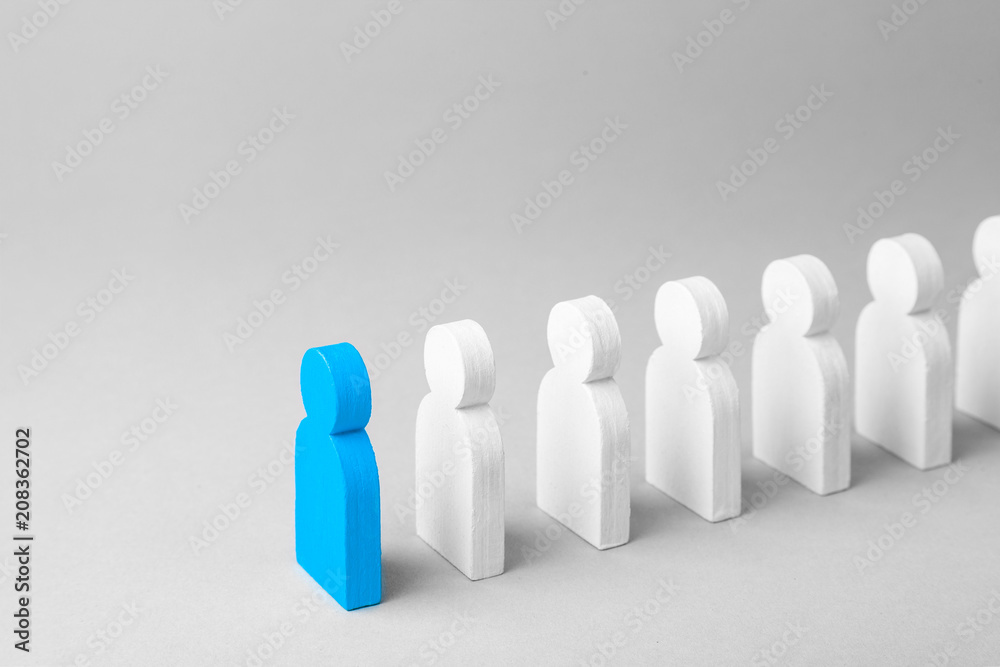 Concept leader of the business team indicates the direction of the movement towards the goal. Crowd of white men goes for the leader of the blue color Concept leader of the business team indicates the direction of the movement towards the goal. Crowd of white men goes for the leader of the blue color