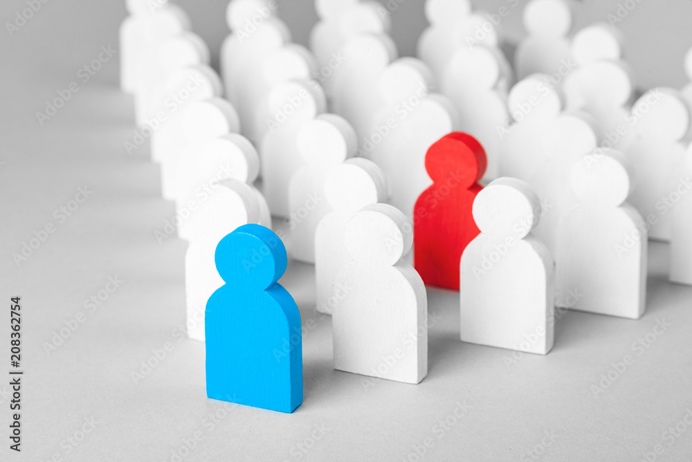 Concept leader of the business team indicates the direction of the movement towards the goal. Crowd of white men goes for the leader of the blue color and bad conflicting employee of red color Concept leader of the business team indicates the direction of the movement towards the goal. Crowd of white men goes for the leader of the blue color and bad conflicting employee of red color