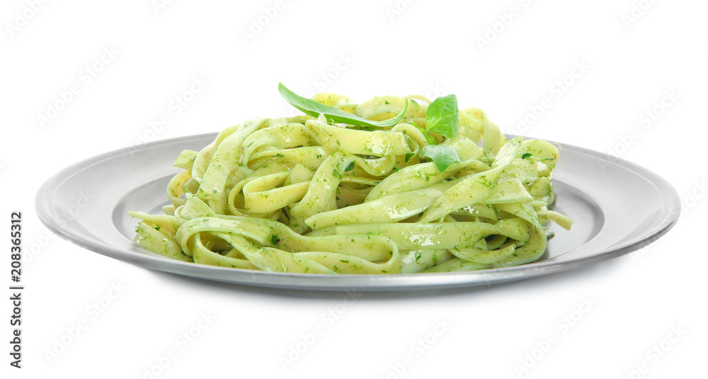 Plate of delicious pasta with pesto sauce on white background