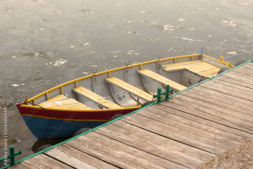 one wooden boat on the dock