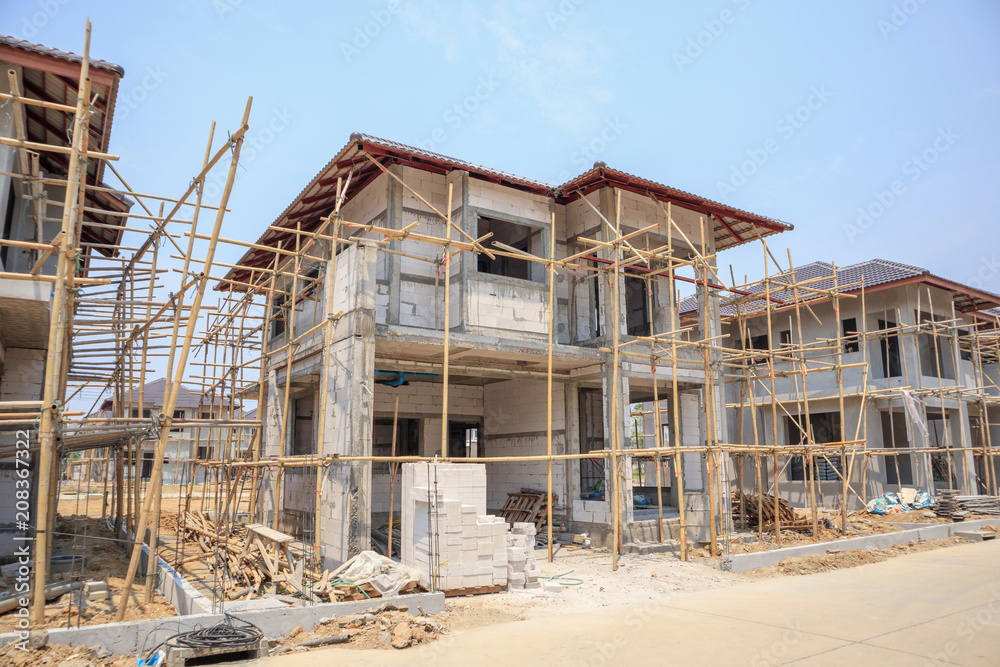 house under construction with autoclaved aerated concrete block structure at building site