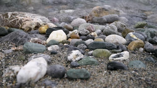 Aegean sea and stone on Prevelly beach, Crete island, Greece photo