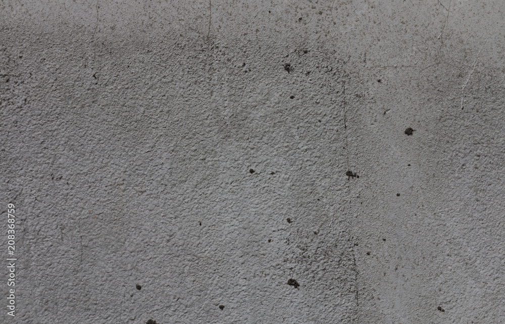 Gray background of concrete with pits and indentations. Gray background of concrete with pits and indentations.
