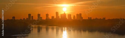 Panorama Warszawy na tle zachodzącego słońca #208370139