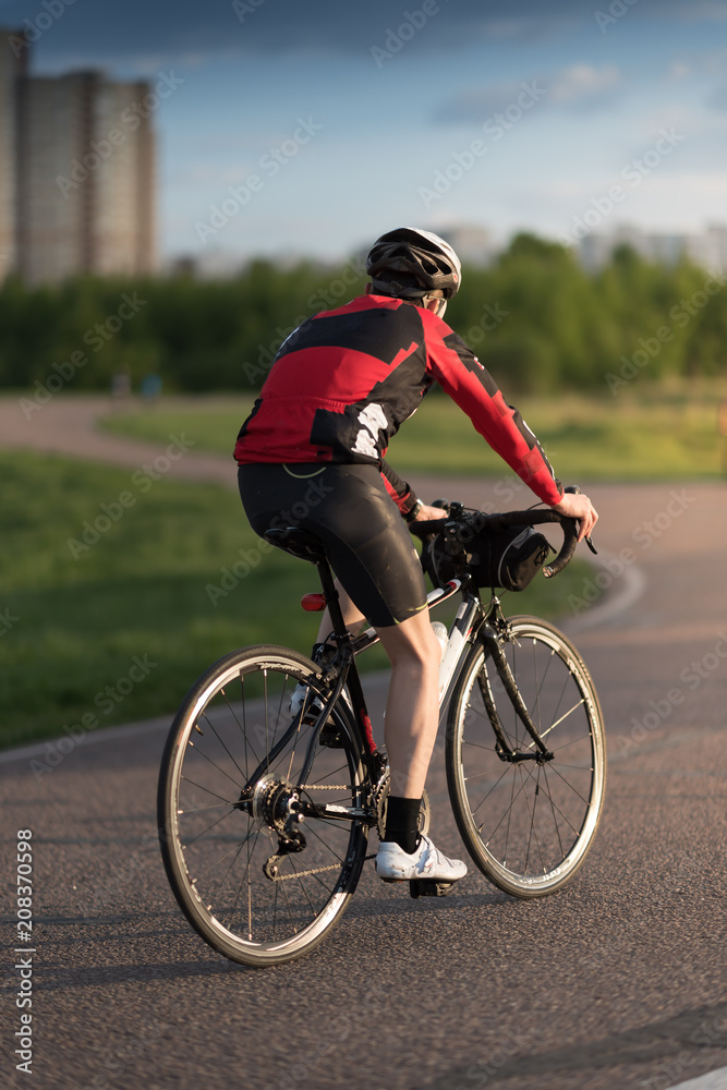 Cyclist in maximum effort in a road outdoors