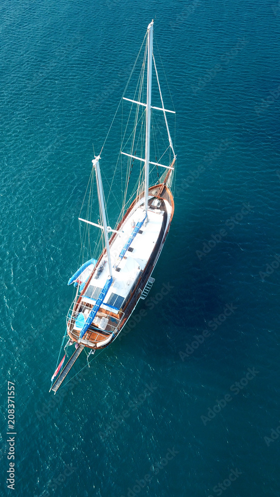 Aerial drone birds eye view of sail boat docked in the Aegean sea, Greece