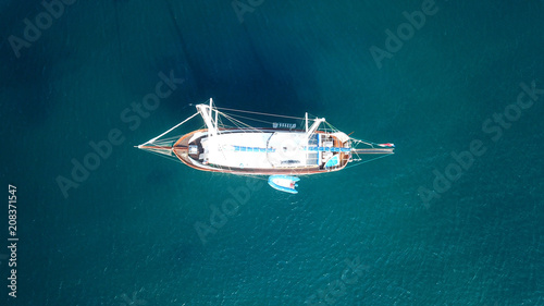 Aerial drone birds eye view of sail boat docked in the Aegean sea, Greece © aerial-drone