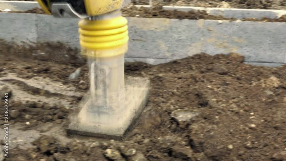 Jumping Jack Compactor, vibratory blower, mechanical jump. Compaction machines, machines for earth compaction. Detail of ground works, construction industry Jumping Jack Compactor, vibratory blower, mechanical jump. Compaction machines, machines for earth compaction. Detail of ground works, construction industry
