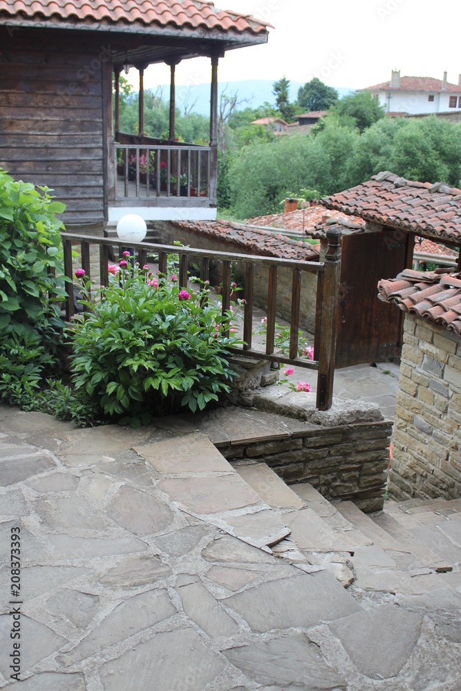 Stairs made from stone,leading to the door in the garden Stairs made from stone,leading to the door in the garden