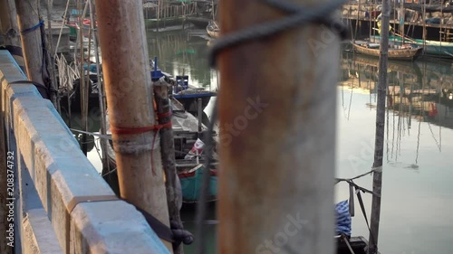 Dolly shot of Small fishing boats in the harbor.