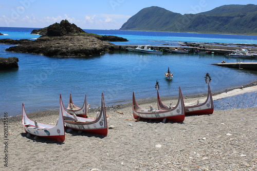 Aboriginal Canoe with Beautiful Feather Decoration on the Beach of Lanyu During Flying Fish Festival at Taitung, Taiwan photo