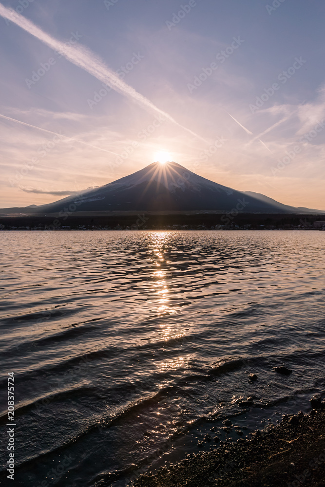 Fuji Diamond. Fuji diamond at Lake Yamanakako in winter season. Diamond Fuji is the name given to the view of the setting sun meeting the summit of Mt. Fuji. Fuji Diamond. Fuji diamond at Lake Yamanakako in winter season. Diamond Fuji is the name given to the view of the setting sun meeting the summit of Mt. Fuji.
