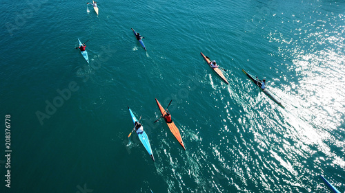 Aerial drone bird's eye view of sport canoe in turquoise clear waters
