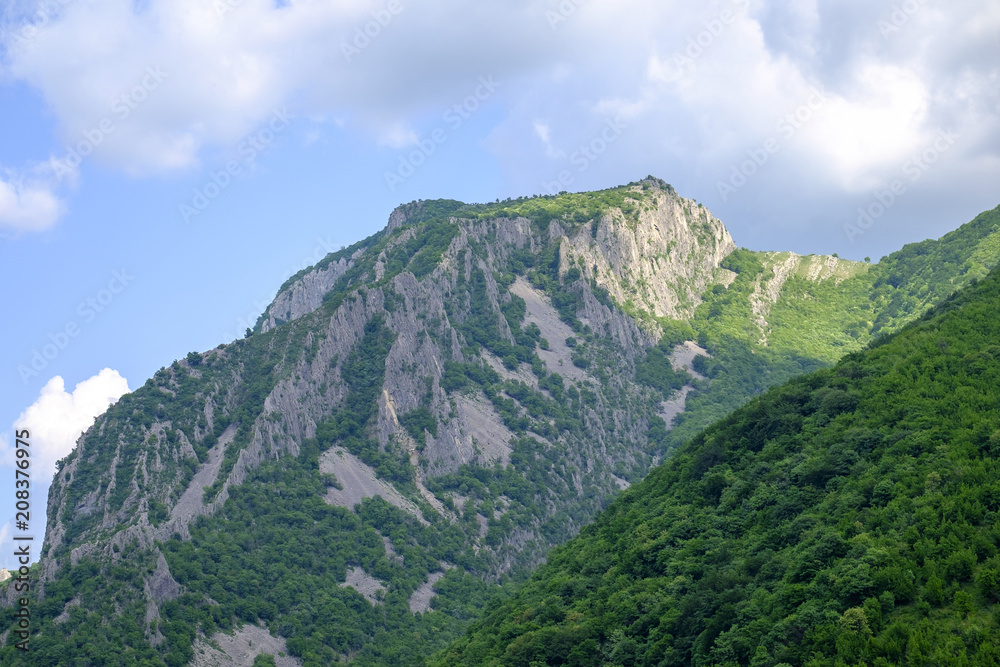 Fototapeta premium Peak of a mountain against a blue sky 1
