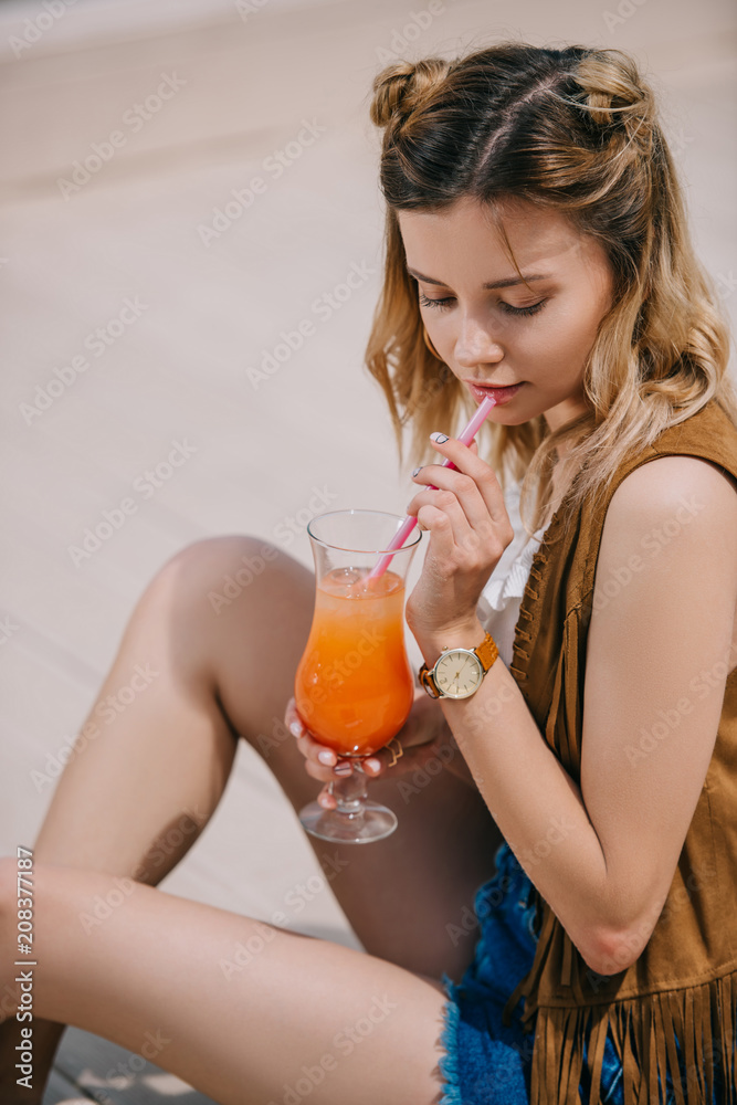 beautiful young woman drinking summer cocktail outdoors beautiful young woman drinking summer cocktail outdoors