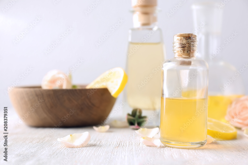 Bottle with essential oil on  wooden table