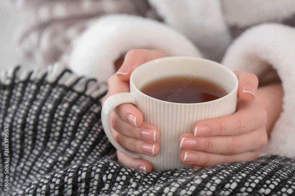 Young woman with cup of hot tea, closeup Young woman with cup of hot tea, closeup