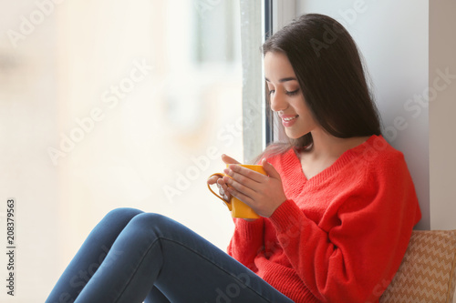 Beautiful young woman with ...