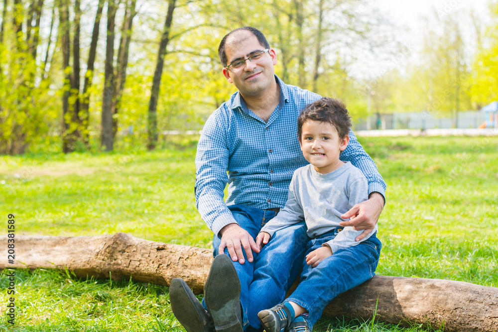 father and son relax in nature