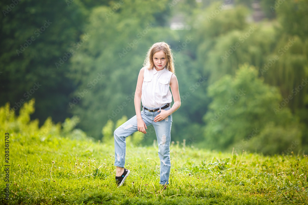 portrait of little beautiful stylish kid girl on green forest background portrait of little beautiful stylish kid girl on green forest background