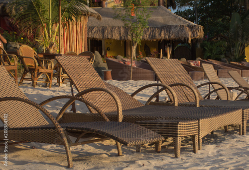 Line of deck chairs on the beach