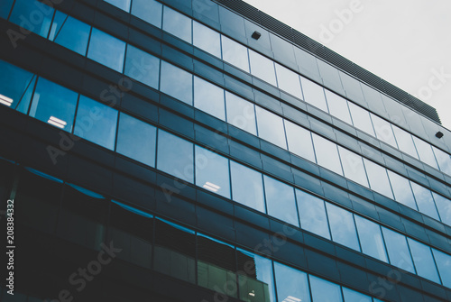 Grey sky reflected in the clean windows of the business center in Wroclaw, Poland