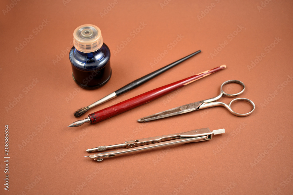 Old art tools stock images. Old tools for drawing. Vintage painting tools on a brown background. Art supplies images Old art tools stock images. Old tools for drawing. Vintage painting tools on a brown background. Art supplies images