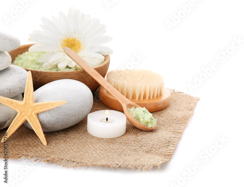 Composition with candles and spa stones on white background