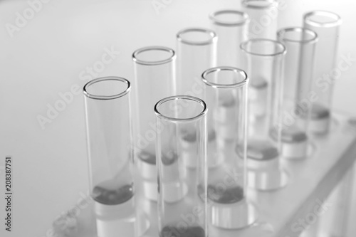 Test tubes in stand on ligh...