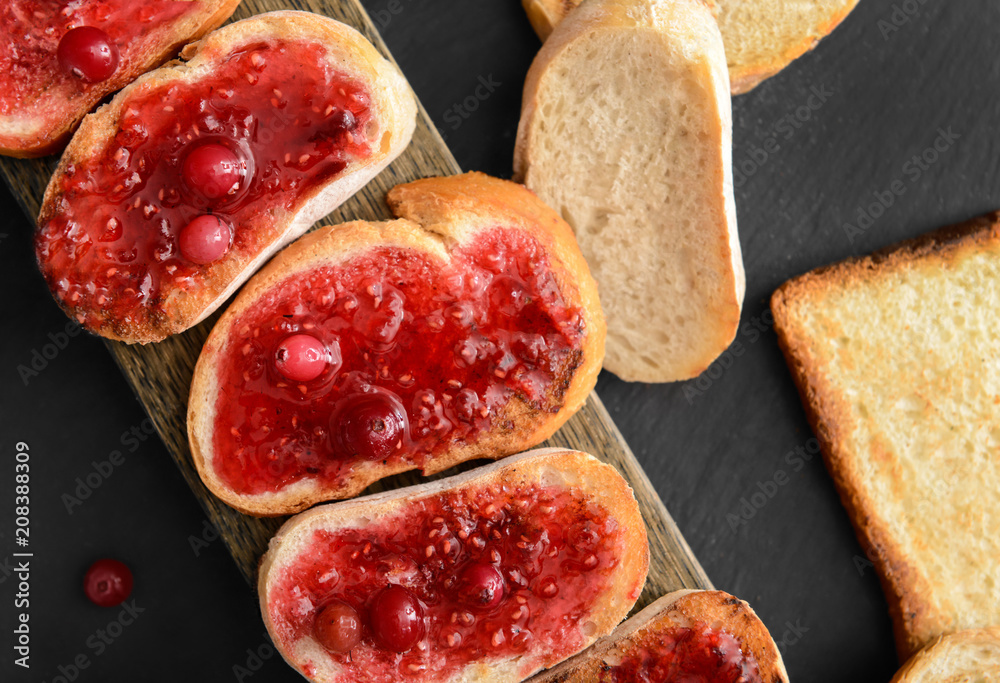Tasty toasted bread with jam on slate plate, top view Tasty toasted bread with jam on slate plate, top view