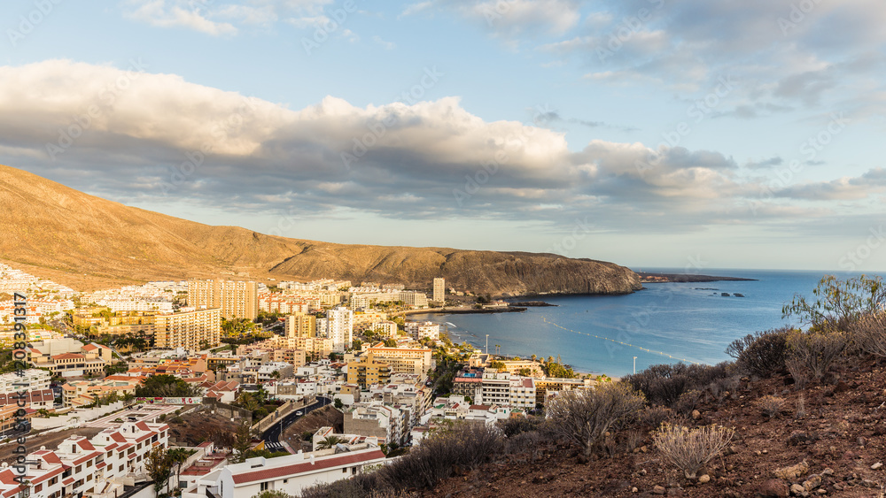 Aerial view on Los Cristianos beach and port during wonderful sunset, Tenerife, Spain.