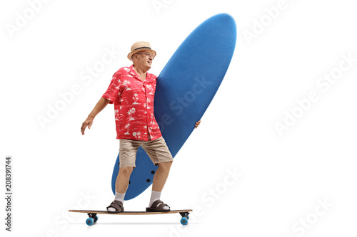 Elderly tourist holding a surfboard and riding a longboard