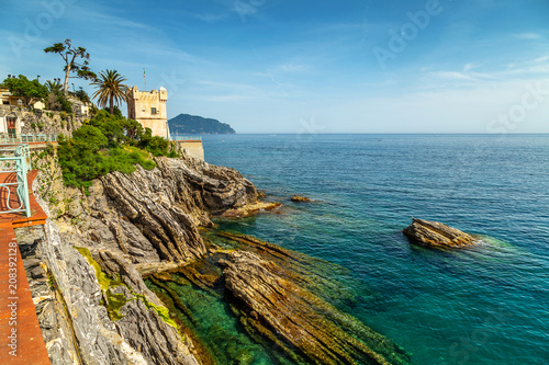 Cliffs and a watchtower at the seaside of Nervi, Genoa, Ligurian sea.  photo