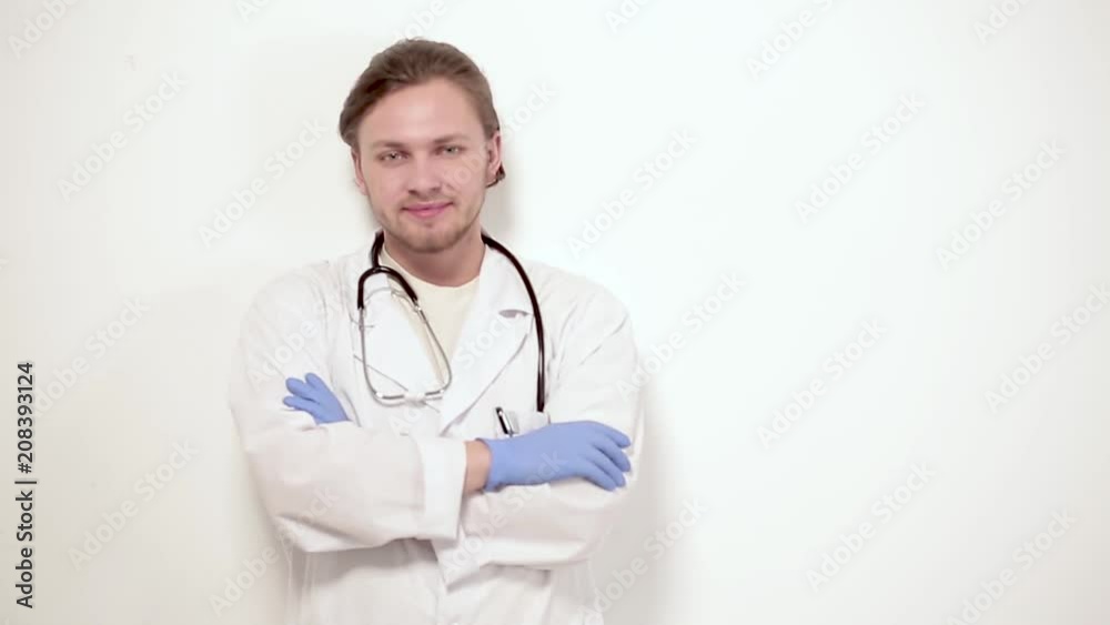 Handsome smiling vet in white gown and medical gloves. Isolated on white background. Handsome smiling vet in white gown and medical gloves. Isolated on white background.