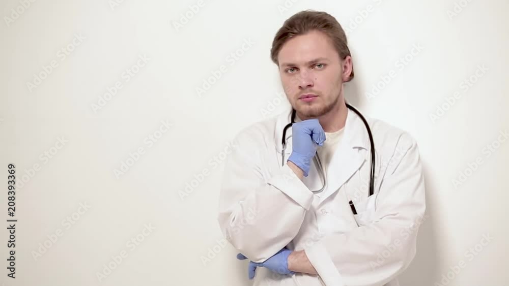 Skilled young vet posing on camera. Isolated on white background. Skilled young vet posing on camera. Isolated on white background.