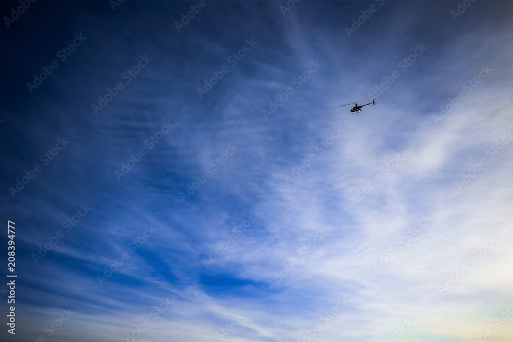 Helicopter landing in sky