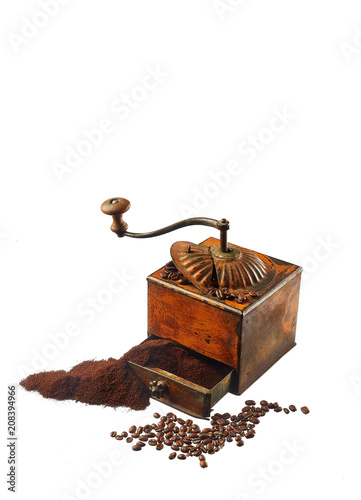 coffee ground and in grains isolated on white background. old coffee grinder.