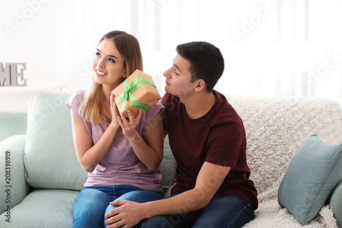 Young woman with gift from ...