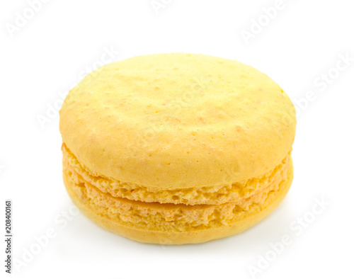 Delicious yellow macaron on white background