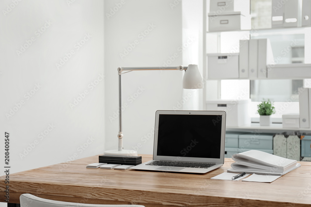 Fototapeta premium Stylish workplace with laptop on table