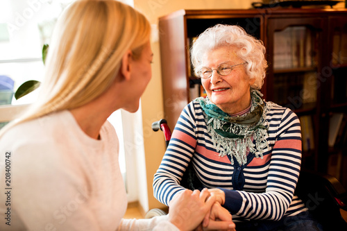 Smiling beautiful senior happy woman with her daughter